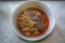 Close-up image of boiled red curry, chicken legs, green vegetables, red pepper, Thai food