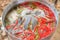 Close-up image of boiled tilapia with fresh red pepper, Thai food, hot pot