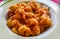 Close up image of a bowl of freshly made gnocchi with tomato sauce