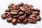 Close up image of a bunch of a roasted coffee beans isolated on white