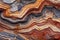 This close-up image captures the vibrant and diverse colors and patterns found on a unique rock., A rough texture of layered