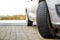 Close-up image of car wheel with black rubber tire