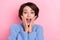 Close-up image of charming impressed lady touching face hear good unexpected news isolated on pink color background