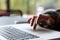 Close up Image of Computer and Hand of Person scrolling Touchpad