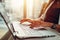 Close-up image of female hands on keyboard. Woman working on laptop