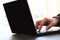 Close-up image of a finger touching texting on keyboard on a laptop computer. Stock photo with white background for copy