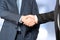 Close-up image of a firm handshake between two colleagues