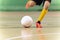 Close-up Image of Futsal Player Kicking Ball. Indoor Soccer Ball Kick. Indoor Football Equipment