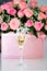 Close-up image of glass of champagne.Bride day dream. Beautiful wedding details and decoration,bouquet with pink roses