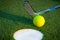 Close up image of golf hole with ball and putt