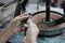 Close up image of hands of a person traditional cutting a gemstone