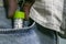 Close up image of homeopathic substance bottle in jeans pocket. Medical health concept