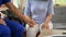 Close-up image of a kind doctor holding or touching a patient\'s hand to comfort