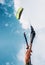 Close up image kitesurfer hand with kite in blue sky