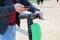 Close up image of a man on an electric scooter paying online