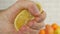 Close Up Image with Man Hand Squeezing Juice from a Fresh Lemon Fruit