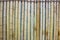 Close up image of an old bamboo wall. decorative wall panel, colorful bamboo stems in a vertical pattern. Group of