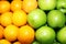 Close up image orange and green apple