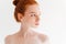 Close up image of Pretty naked ginger woman looking away