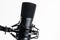 A close up image of proffesional studio microphone isolated on the white background