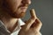 Close up image of sommelier examining smell of wine cork