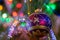 Close up image of sparkling colored glass ball hangs on the Christmas tree.