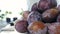 Close Up Image with Sweet Aromatic Ripe Plums Rotated in Slow Motion on the Table in the Kitchen