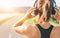 Close up image of teenager adjusting  wireless headphones before starting jogging and listening to music