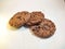 Close up image of three all time favourite, crunchy texture cookies, sprinkle with abundant, delicious chocolate chips