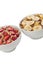 Close up image of two bowl of cereal with different fruits