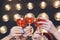 Close up image of woman hands with stylish manicure holding glasses with champagne , black and white style, party time