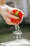 Close-up image of woman washing red bell paprica on sink