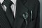 Close-up image of wrench in a pocket of suit businessman