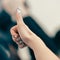 Close up. image of a young businesswoman showing a thumbs up.