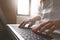 Close-up image of young woman hands typing and writing massages on laptop,working on cafe or home