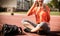 Close up image young woman take a break from exercise, listening