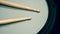 Close-up images of drumsticks on electronic drum snare pad