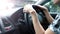 Close-up images of woman hands driving car with confidence