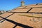 A close-up on an incomplete roofing construction on the stage of roof sheathing with self-adhering rubberized asphalt flexible