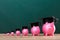 Close-up Of Increasing Pink Piggy Banks