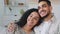 Close up Indian Hispanic married couple ethnic spouses curly woman girlfriend wife and bearded man boyfriend husband