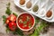 Close-up of Indian Homemade fresh and healthy tomato soup garnished with fresh coriander leaves and ingredients and herbs,