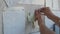 Close-up, Indian student hands attach to wall sticker