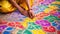 Close up of Indian woman hands on the floor with colourful painting