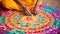 Close up of indian woman\\\'s hands with colorful paisley