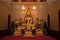 Close up indoor shiny golden buddha statue in buddhist temple in