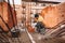 Close up of industrial bricklayer installing bricks