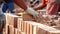 Close up of industrial bricklayer installing bricks on construction site