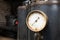 Close up of an industrial pressure gauge.