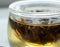 Close-up infusing herbal tea in glass mug